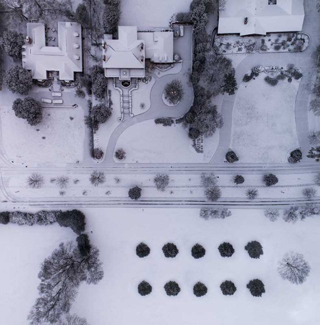 aerial view of residential snow covered houses