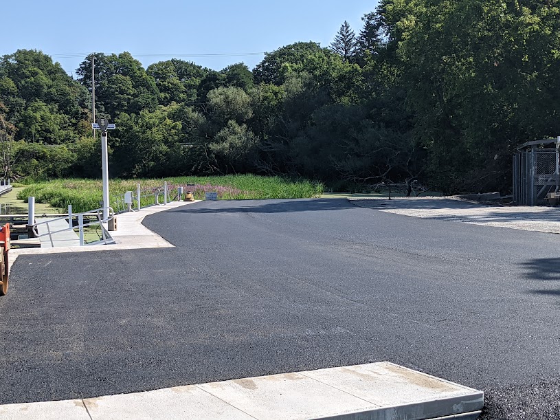 an empty parking lot with a fire hydrant