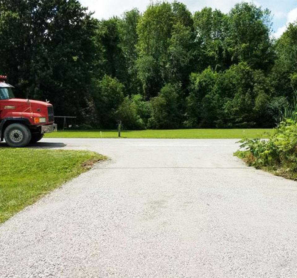 a truck parked at the end of a driveway