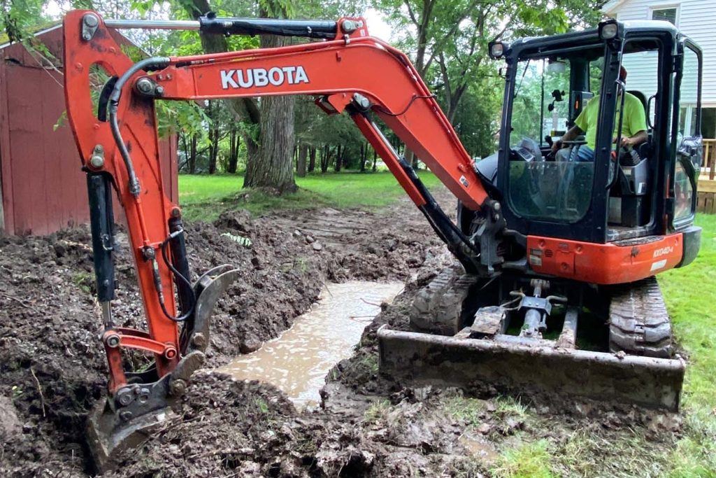 a JCB digging a trench