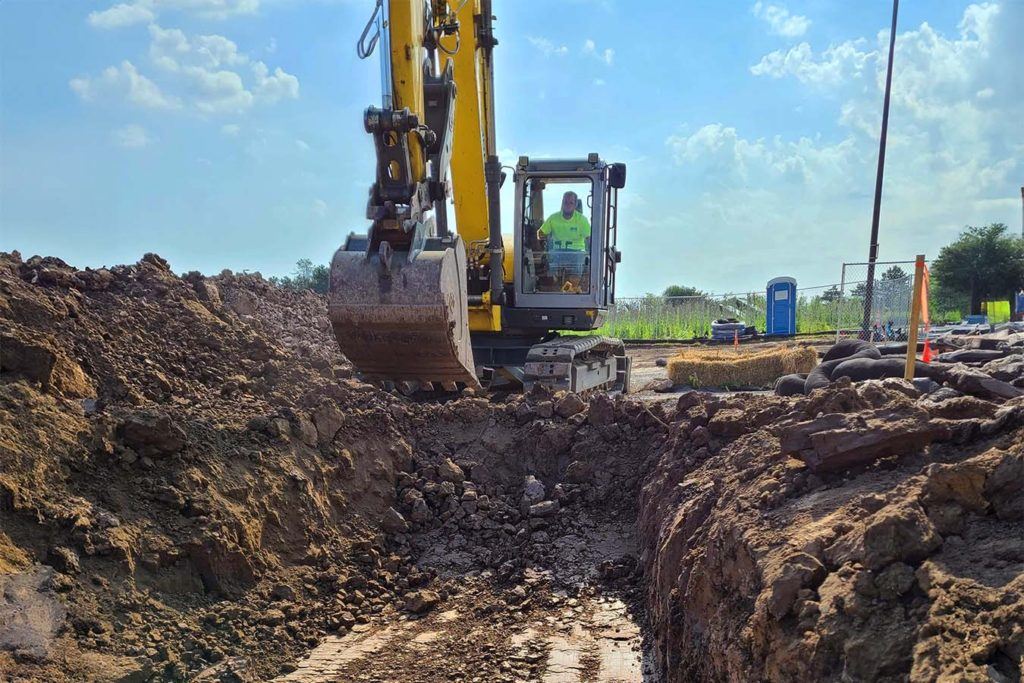 a JCB digging a trench