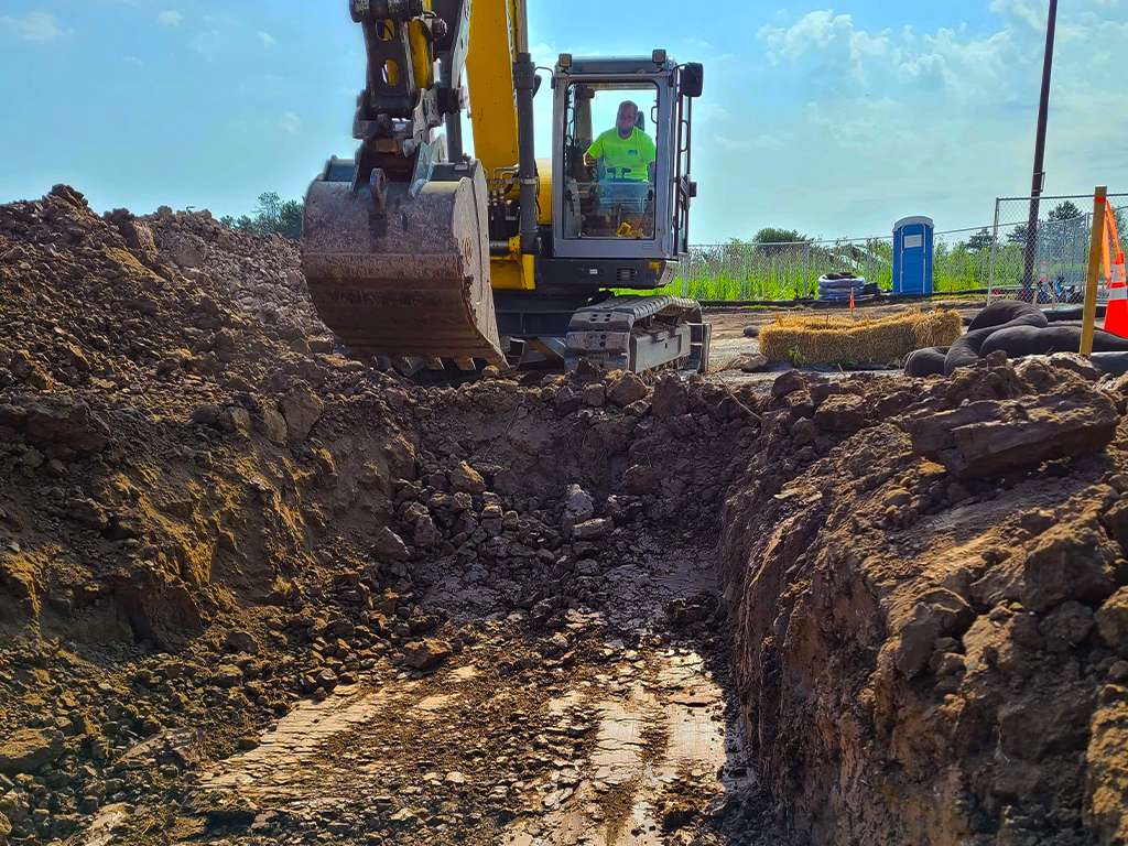 a jcb digging a trench